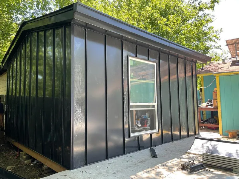 Black standing seam metal wall panels for Roof Inspection in Clute