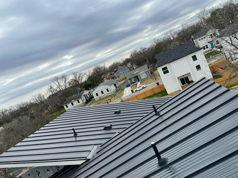 Standing seam metal roof panels with vents for Skylight Repair in Clute